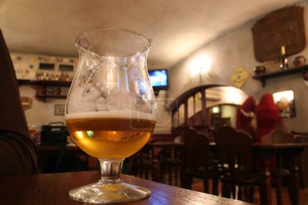 Glass with beer in bar