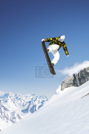 Snowboarder in the high mountains