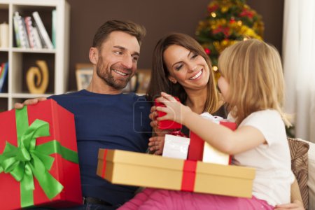 Happy family with christmas gifts