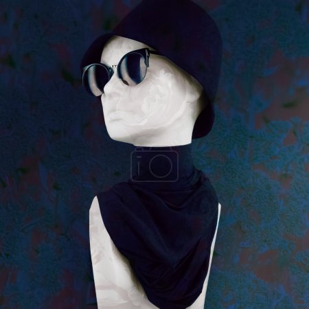 Mannequin Wearing Black Hat Sunglasses and Scarf