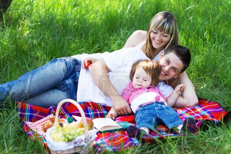 Young family of three on a picnic