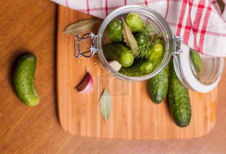Cucumbers in rustic jar
