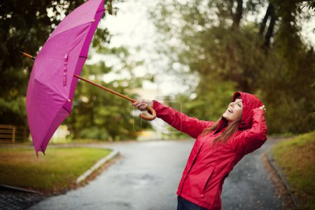 Young woman with pink umbrella