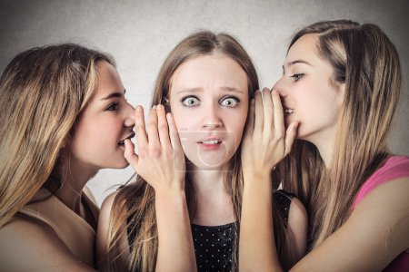 Women telling secrets