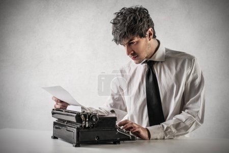 Businessman using his typewriter