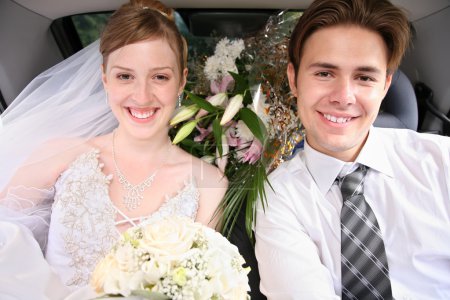 Bride and fiance in the automobile