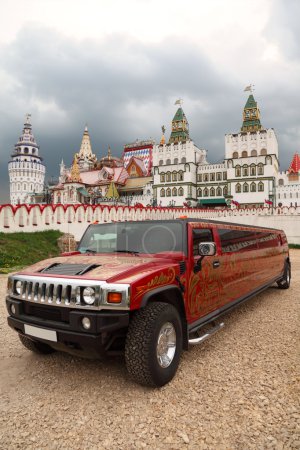 Kremlin in Izmailovo Moscow and red limousine with khokhloma pat