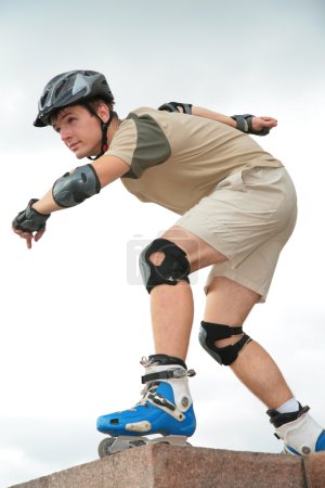 Boy on rollerblades in starting position