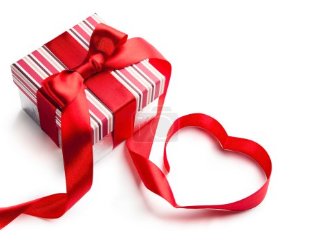 Art gift box with red ribbon in heart shape isolated on white ba