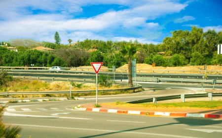 The asphalted road and road signs in Israel