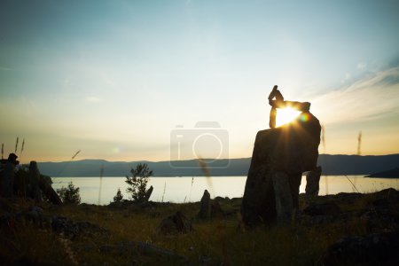 Stone landscape against a decline lake Baikal