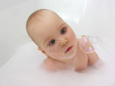 Baby in bath with fly bubble
