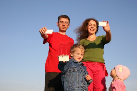 Family with cards for text