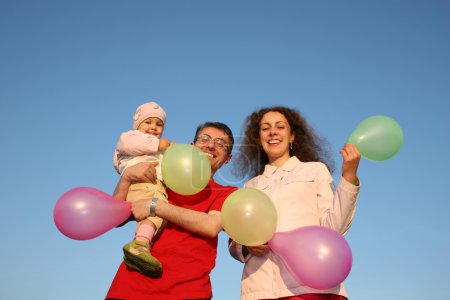 Family with baby and balloons