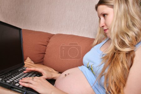 Pregnant girl with notebook
