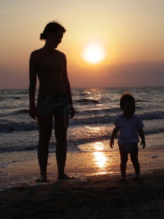 Mother with baby on beach