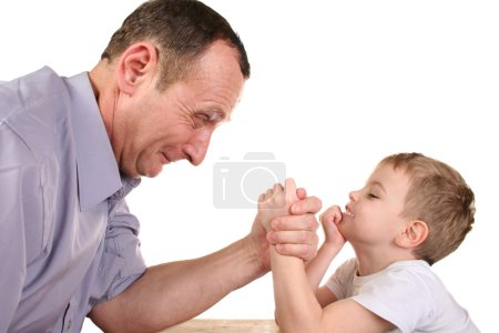 Boy grandfather wrestling