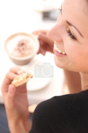 Young woman enjoying coffee break