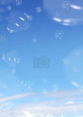 Soap bubbles over blue sky background