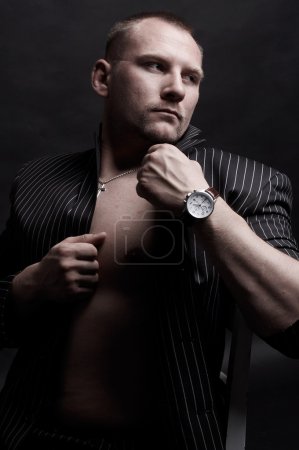 Portrait of a handsome young man with watch