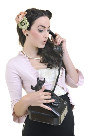 Pretty girl talking on old phone