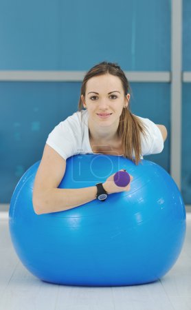 Young woman drink water at fitness workout training at sport club