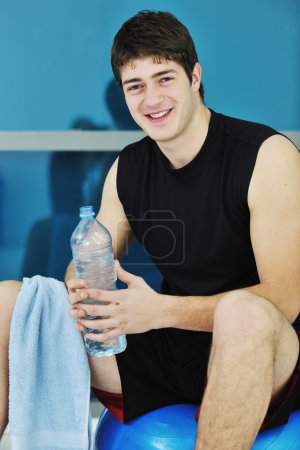 Man drink water at fitness workout