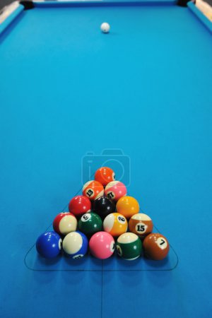 Young man play pro billiard game