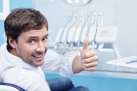 Attractive man in a the dental chair