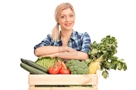 Young woman posing with vegetables 
