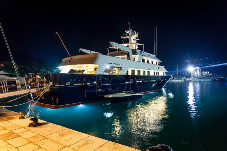 luxurious private yacht moored at night port