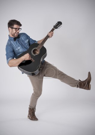 Fashion musician with guitar