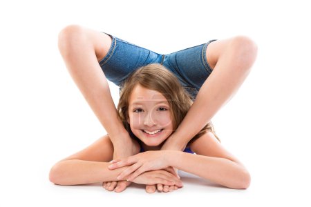 Flexible contortionist kid girl playing on white