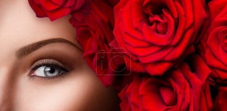 woman  eye with red roses