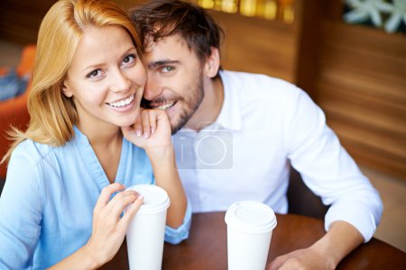 Young couple sitting in cafe