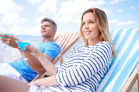 Couple resting in deck chair