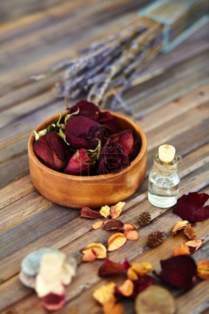 Petals and bottle of aromatic liquid