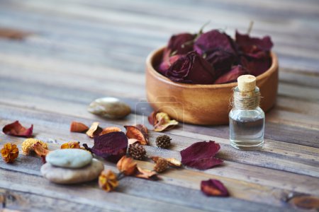 Petals and vial with rose essence