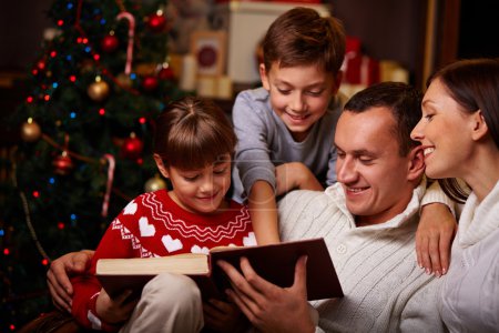 Family reading Christmas fairy tales