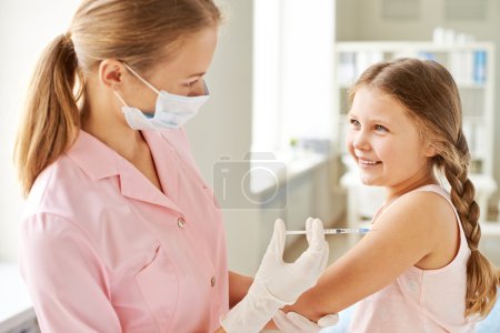 Nurse making girl injection