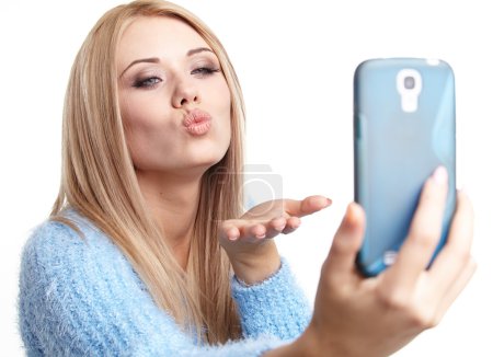 Blonde girl taking selfie