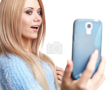 Blonde girl taking selfie