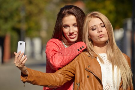 Beautiful young women making selfie