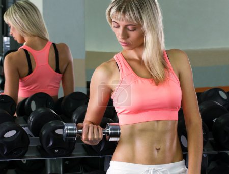 young woman with dumbbells