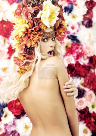 Surprised naked girl with the wreath