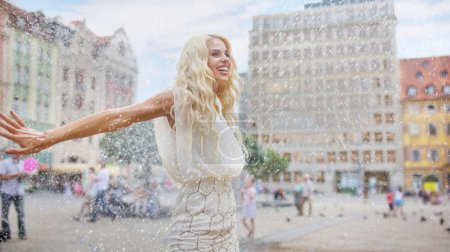 Woman dancing in the rain