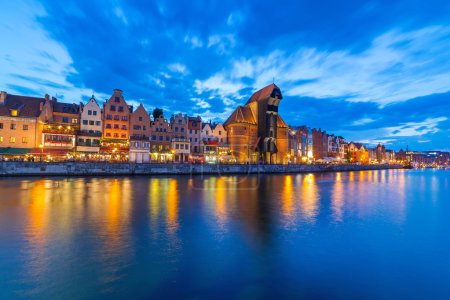 Gdansk at night with reflection in Motlawa river