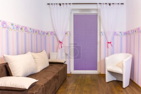 Bright baby room with wallpaper