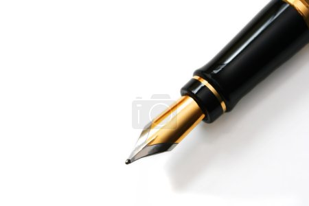 Closeup of gold-nibbed fountain pen over white.