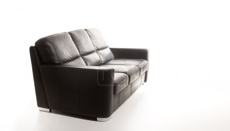 Isolated black couch against white background